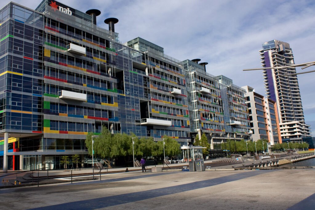 NAB to Cut Up to 2,500 Roles as It Simplifies Its Operating Model National Australia Bank building in Docklands, Melbourne